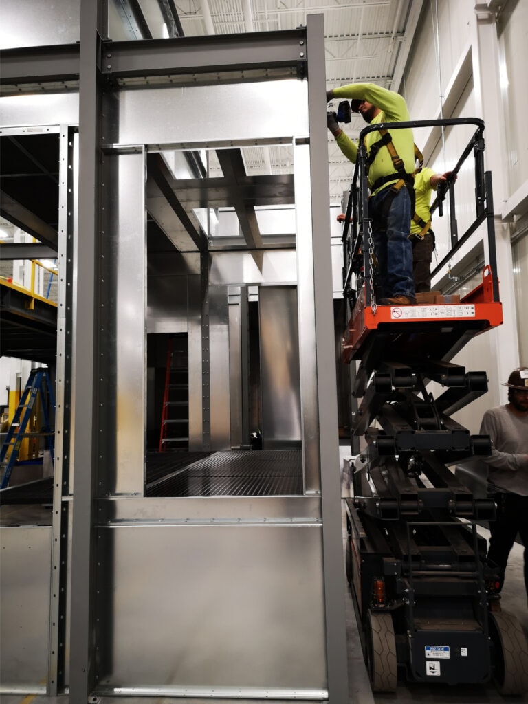 System construction — technician on scissor lift