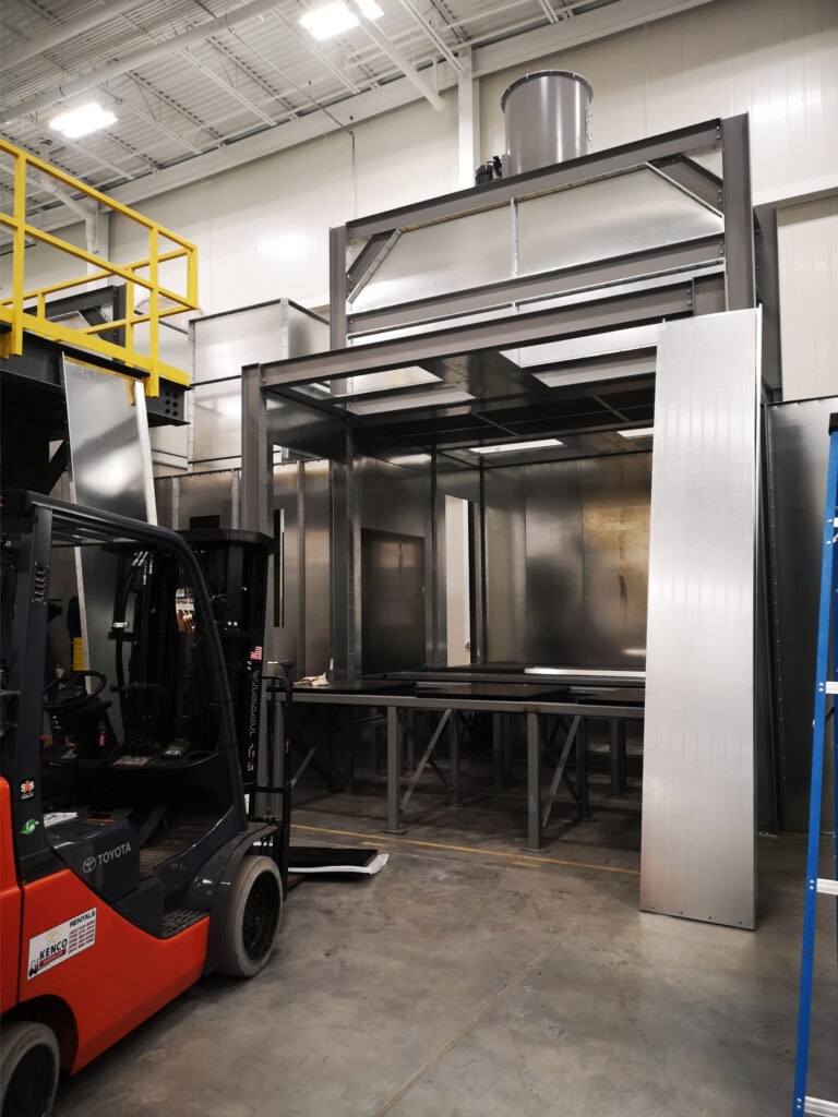 System construction — forklift positioning booth section