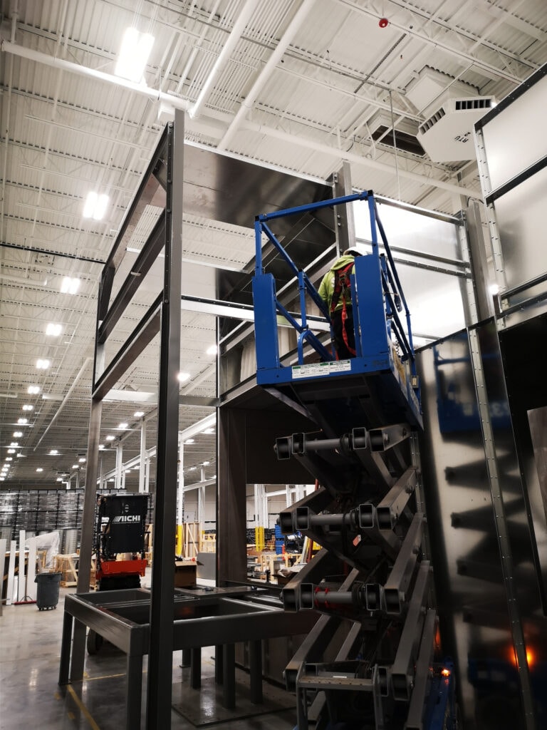 System construction — technician on elevated platform