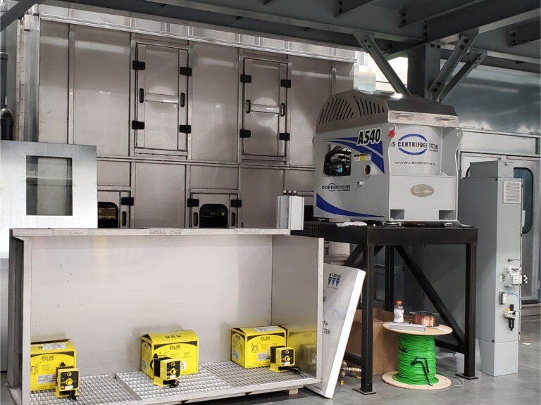 System construction — centrifuge system and pump components staged