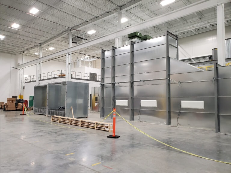 System construction — spray booth exterior with ductwork staged