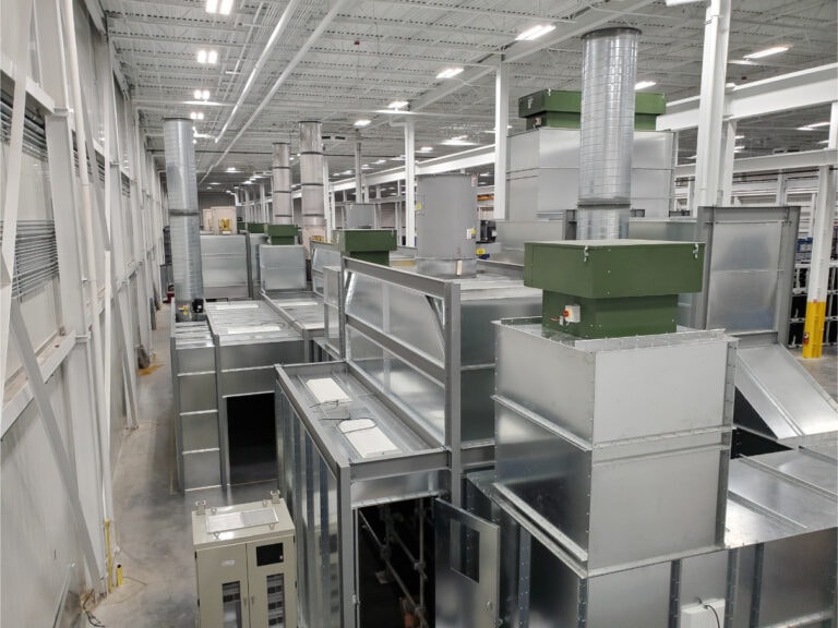 System construction — wide view of full finishing line with UV booths