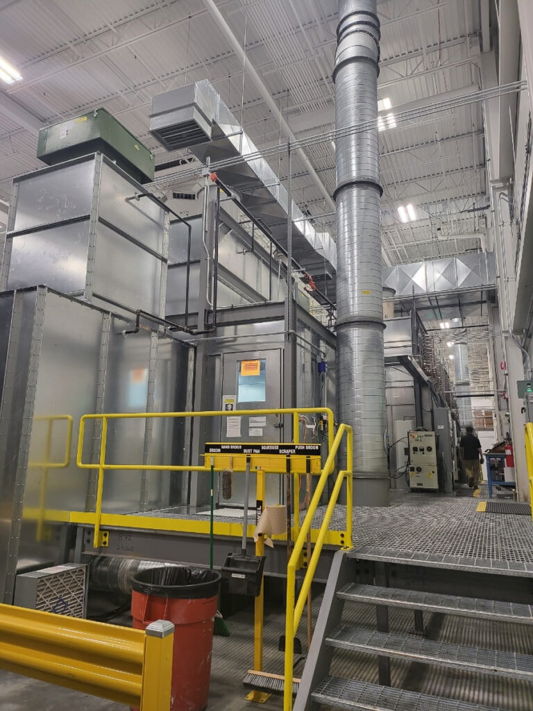 Turnkey finishing line — mezzanine structure with yellow safety railings